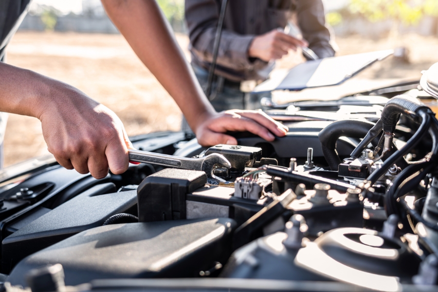 Person doing car maintenance